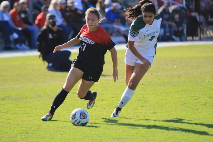 Fresno City College  forward Ashtyn Bracamonte gets past a Evergreen Valley College defender during a playoff match on Saturday, Nov. 18, 2017.