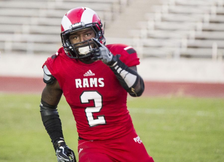 Fresno City College running back Khai Williams celebrates after scoring a touchdown during the State Center Bowl game against Butte College on Saturday, Nov. 18, 2017.