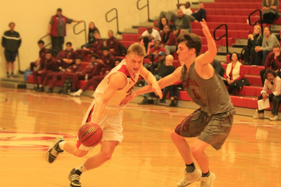 Fresno City College guard Tyus Millhollin gets past an opposing Sierra College player during the Rams Fall Classic tournament on Saturday, Nov. 18, 2017.