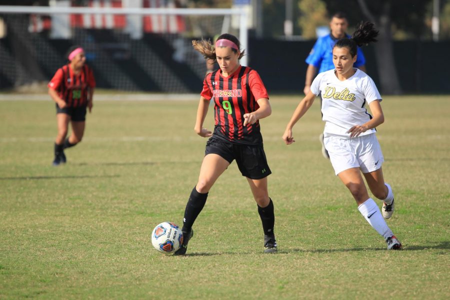 Fresno City College forward Riana Wristen takes control of the ball during a playoff game at home against San Joaquin Delta College on Saturday, Nov. 25, 2017.