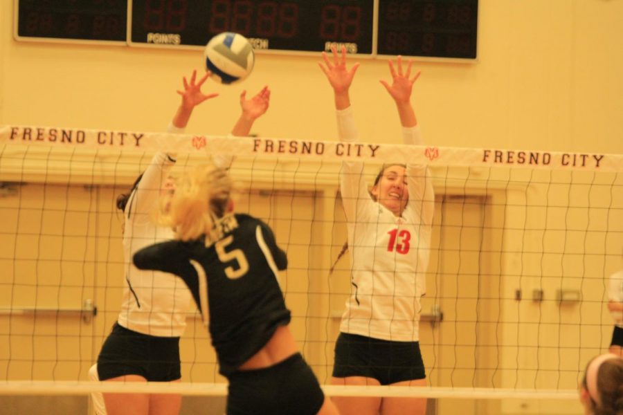 Fresno City College womens volleyball players get a block during a home match against San Joaquin Delta College on Saturday, Nov. 25, 2017.