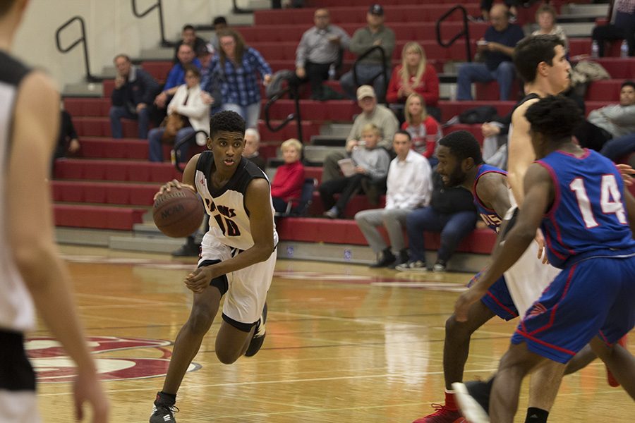 Sophmore Guard, Eric Pierce for the Rams driving to the basket against West Hills Coalinga at Fresno City College Wednesday. Jan 17. 