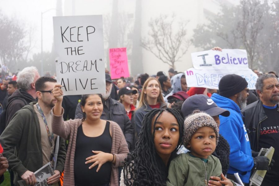 People+hold+signs+and+gather+around+Fresno+City+Hall+on+Monday%2C+Jan.+15%2C+2018+to+commemorate+Martin+Luther+King+Jr.+and+his+legacy.