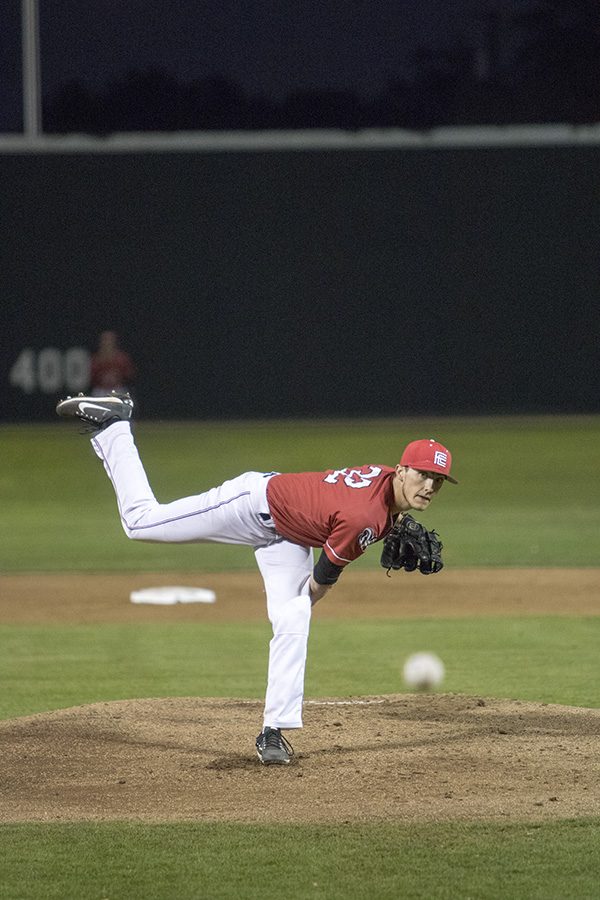 Pitcher Noah Parsons, throws a fast ball down the middle against a player from Sacramento City College on Friday Feb. 16, 2018.