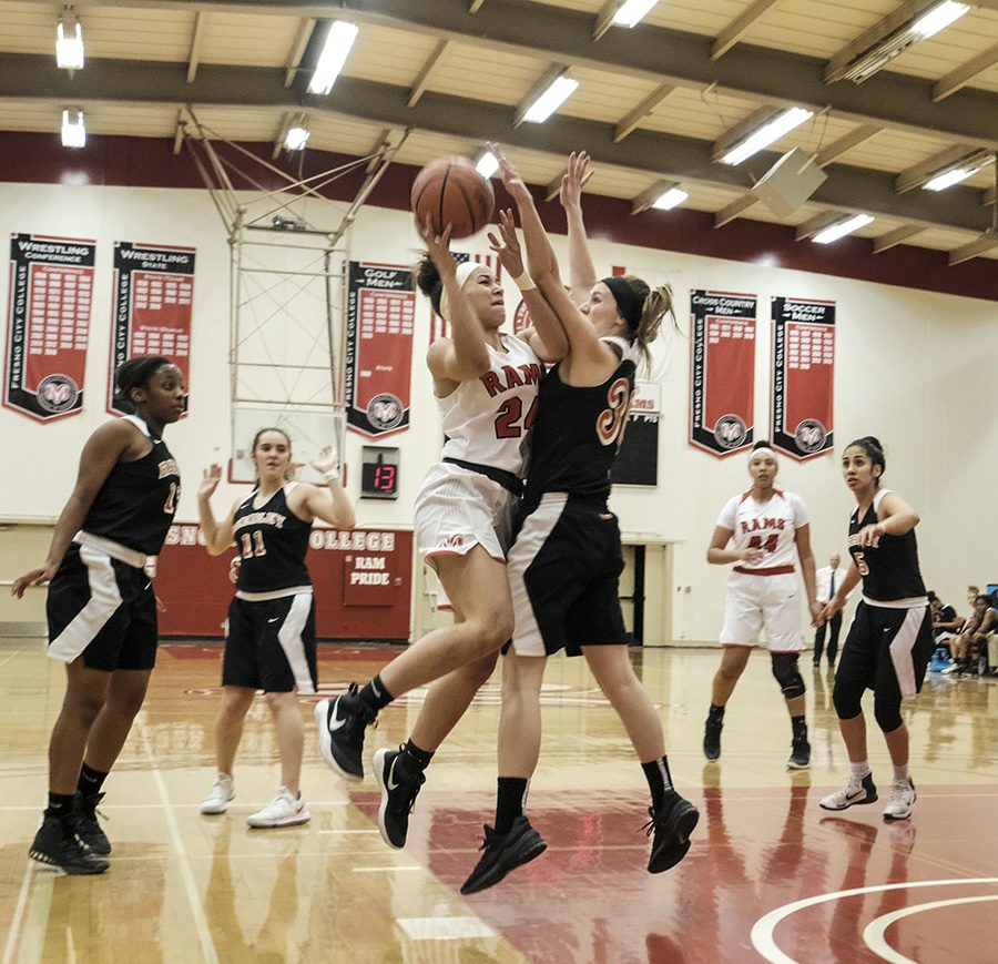 FCC Rams guard Jaiden Jones jumped for a shot against Reedley Tigers guard Kristy Berry. 