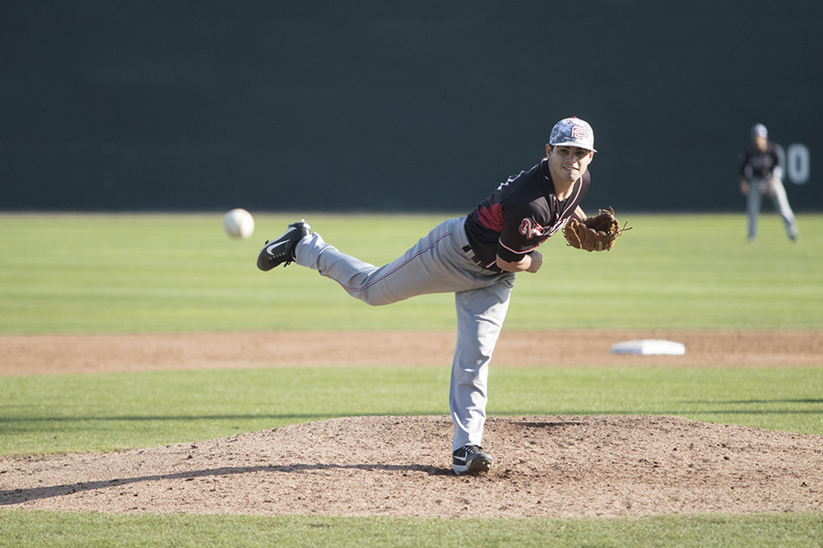 Pitcher DJ Martinez, throws a fast ball down the middle against a player from Skyline on Saturday, Jan 27, 2018.