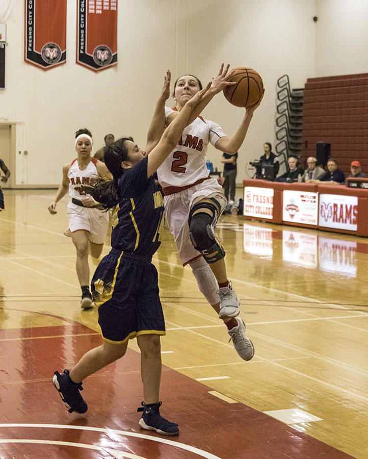 Sophmore Julia  Cuellar for the Rams driving to the basket against Merced College at Fresno City College Saturday. Feb. 17, 2018.