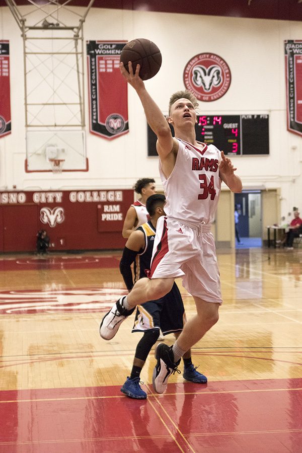 Sophmore guard Tyus Millhollin for the Rams jumping for a layup against Merced College at Fresno City College Saturday. Feb. 17, 2018.