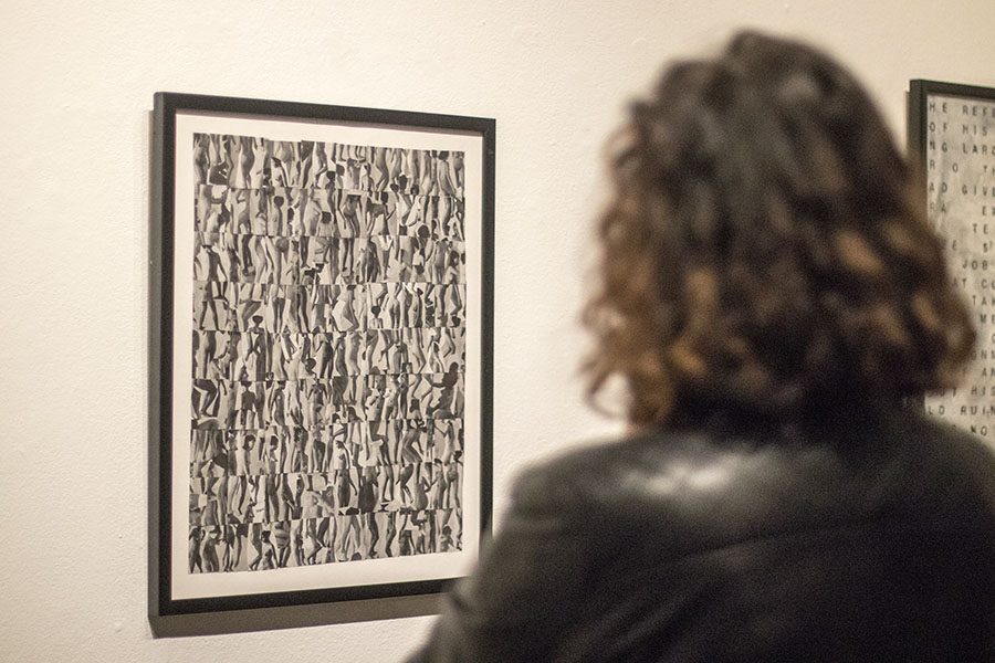 Fresno City College alumna Teresa Flores admires an untitled art piece by Carmen Winant in the art space gallery on Thursday, March 1, 2018. 