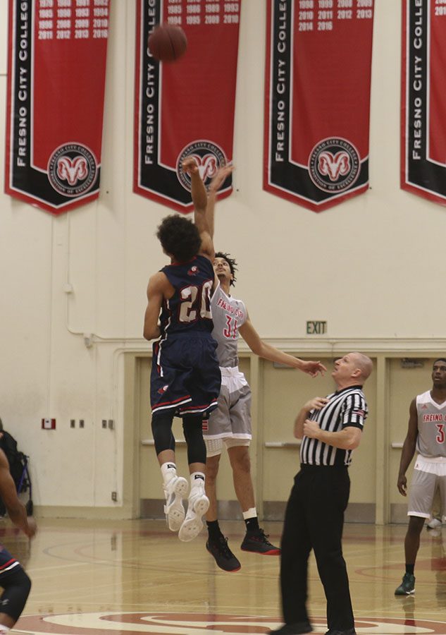 FCC Gaurd Jared Small battles for possition of the ball against Gavilan Gaurd Xander Bowers during jump ball at start of Regional Final game. Photo by Jamila McCarty