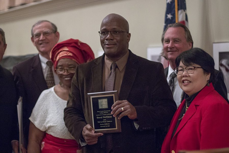 Darryl+Du%27Chene+holds+his+award+after+being+inducted+into+the+Wall+of+Honor+at+a+ceremony+in+the+Old+Administration+Building+on+Monday%2C+Feb.+26%2C+2018.+