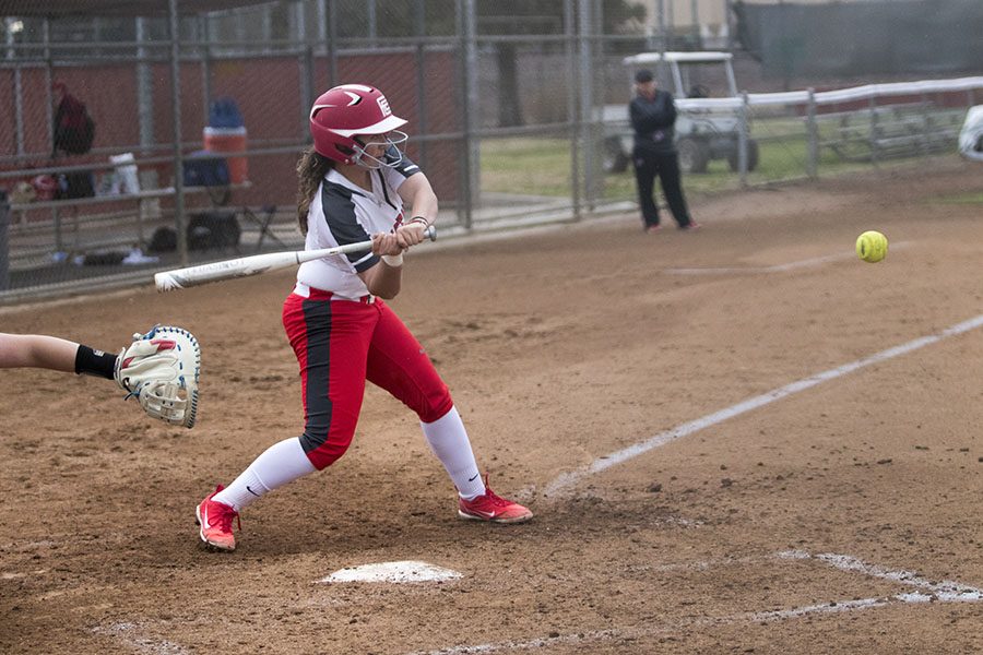 Outfielder freshman Daci Tovar hits a fastball thrown by a player from Siskiyous at Fresno City College on Saturday, March 3, 2018. Photo by Larry Valenzuela