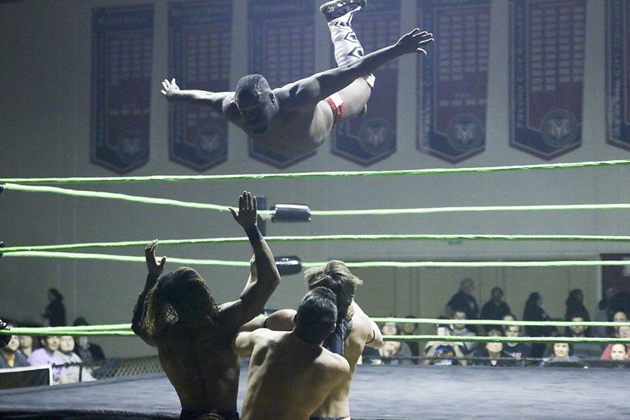 Owen Travers defies gravity with a dive onto his opponents and partner below during Best of the West on Saturday, March 17 at Fresno City College.