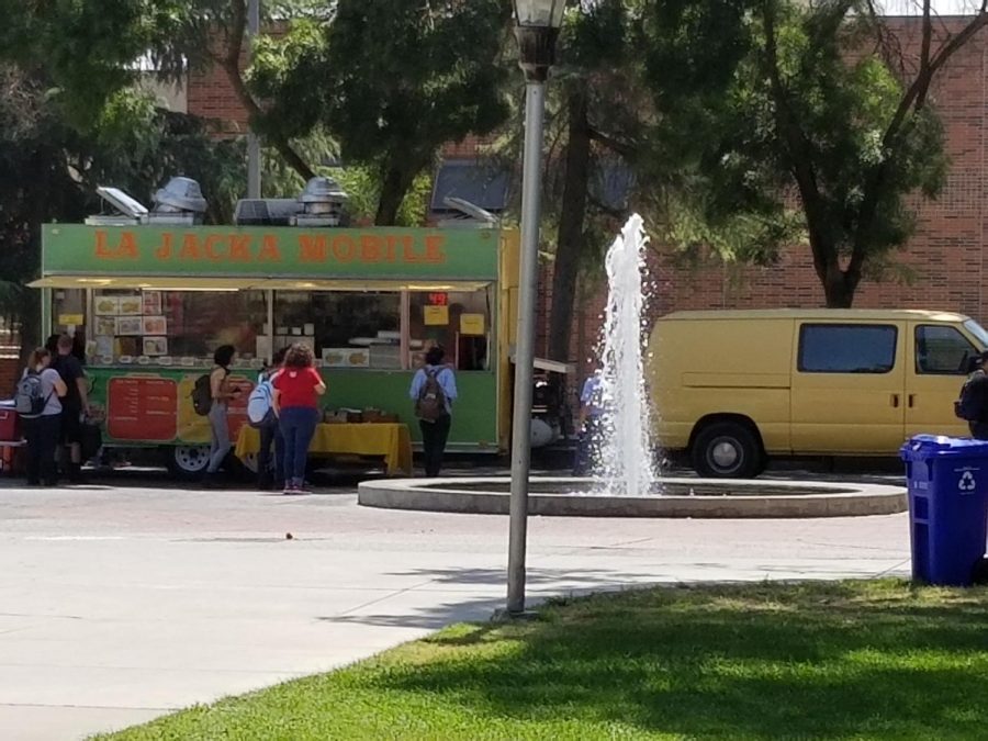 La Jacka Mobile Taco Truck serves students at the small fountain near the library on Monday, Aug. 20, 2018.