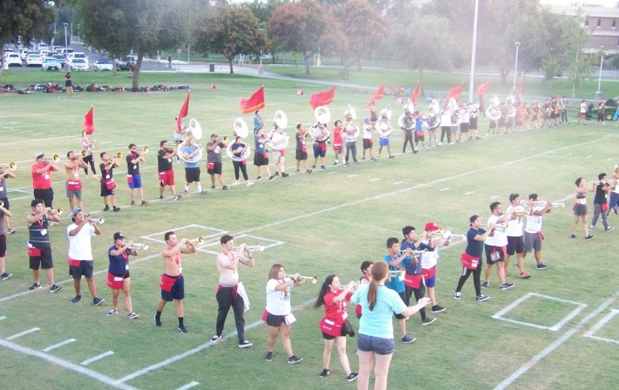 Fresno State marching band practices their formations at the Fresno State practice field on Saturday, Aug. 18, 2018