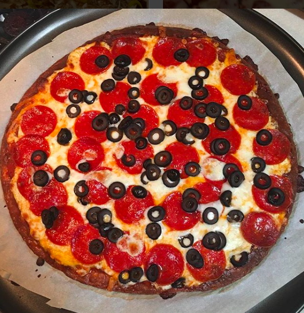 Keto-style+pizza%2C+also+known+as+Fathead+Pizza%2C+which+includes+almond+flour%2C+mozzarella+cheese%2C+cream+cheese%2C+and+other+toppings.+Sept.+18%2C+2018.