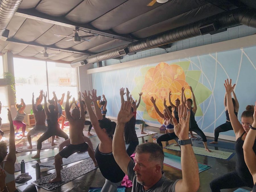 Tower Yoga patrons are ‘striking a pose’ in their Hot Vinyasa Flow Yoga Class on Saturday, Sept. 22, 2018.