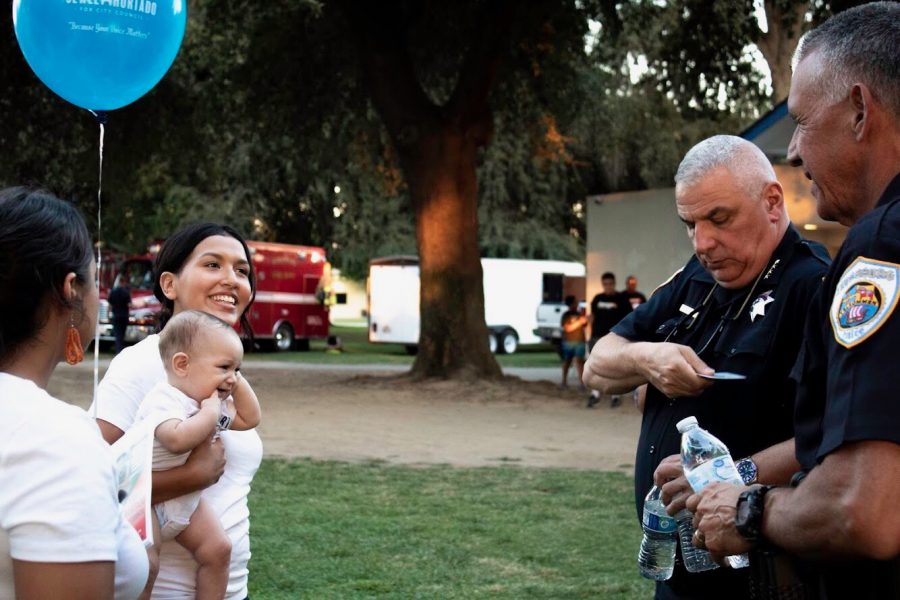 Jewel Hurtado with her son and community members.