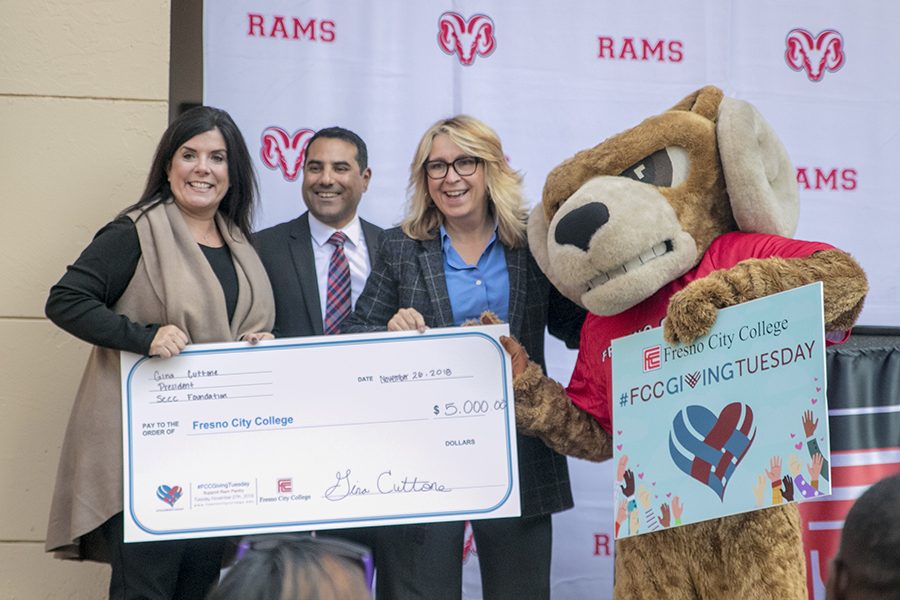 Carole Goldsmith receiving a check for $5,000 donated by The Foundation for the Ram Pantry for the Fresno City College Giving Tuesday.