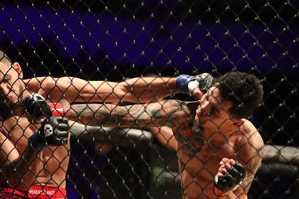 Pablo Sabori (right) trading blows with Michael Irizarry (left) during the second match of the Copa Combate at the Save Mart Center in Fresno CA, on Friday Dec. 07, 2018.