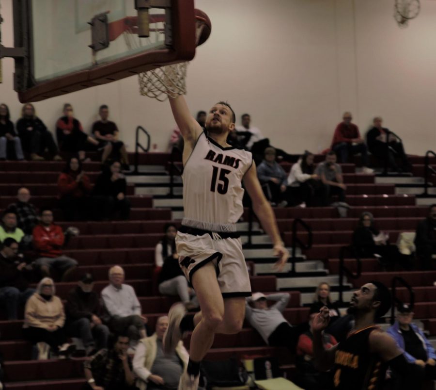 Ian Miller rises above the rim to score against Columbia College on Jan. 16, 2019.