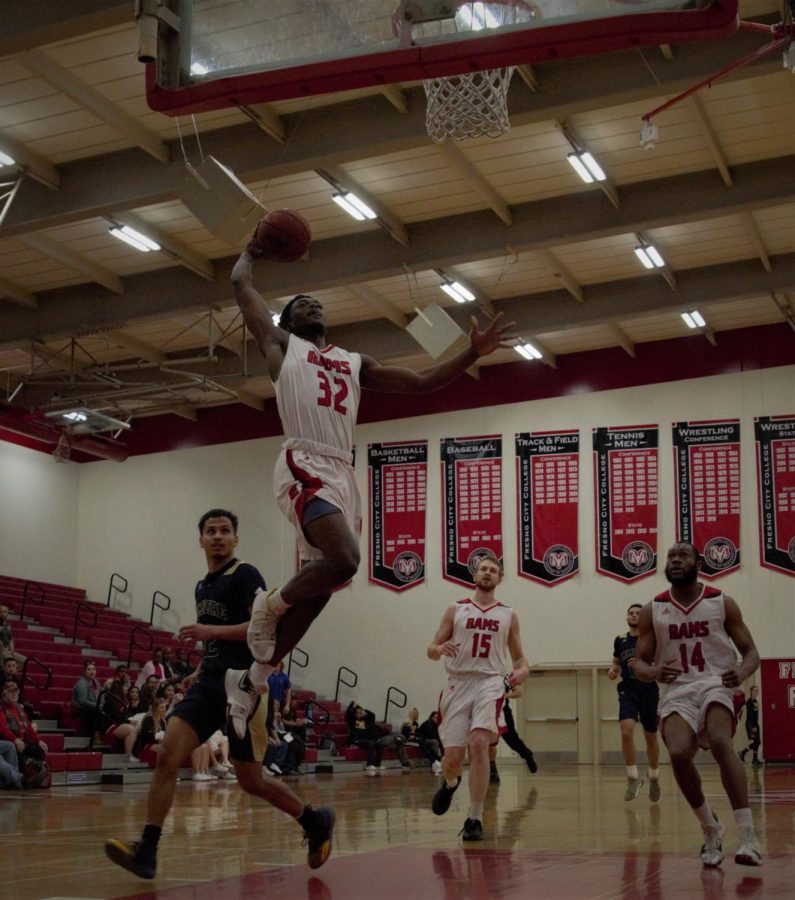 Freshman guard/forward Ronald Agebsar takes to the sky on his way to a dunk in the Rams' dominating 151-56 win over West Hills Lemoore on Jan. 30, 2019. Photo by Ben Hensley