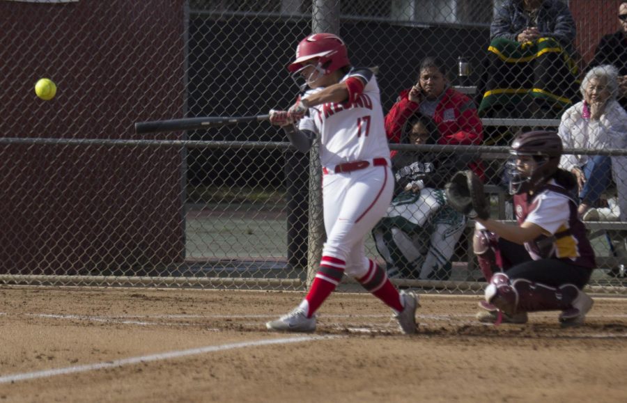 Sophomore Infinity Chacon belts a base hit in the Rams 8-0 win over Hartnell College on Feb. 18, 2019. Photo by Ben Hensley