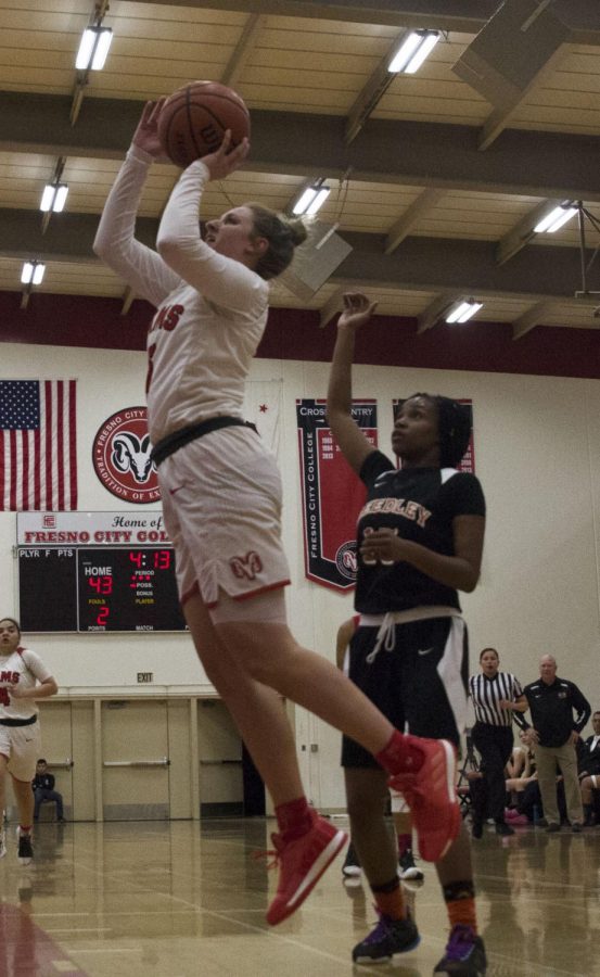 Freshman+guard+Jordyn+Brown+rises+above+the+defense+for+a+shot+against+Reedley+on+Feb.+20%2C+2019.