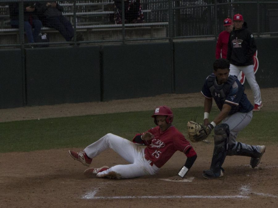 Travis Moore slides in safely to score a run for the Rams in their 5-3 win over Yuba College on Feb. 26, 2019.