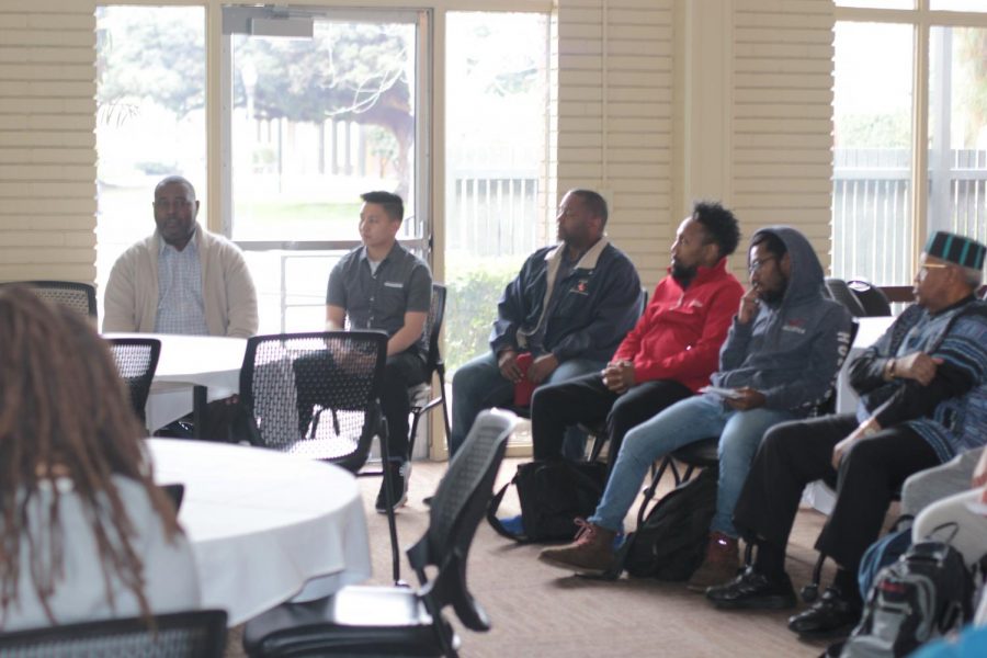 Rodney Murphy, advisor for the SYMBAA and Idile programs speaks at the Mens Rites of Passage Ceremony for Black History Month 