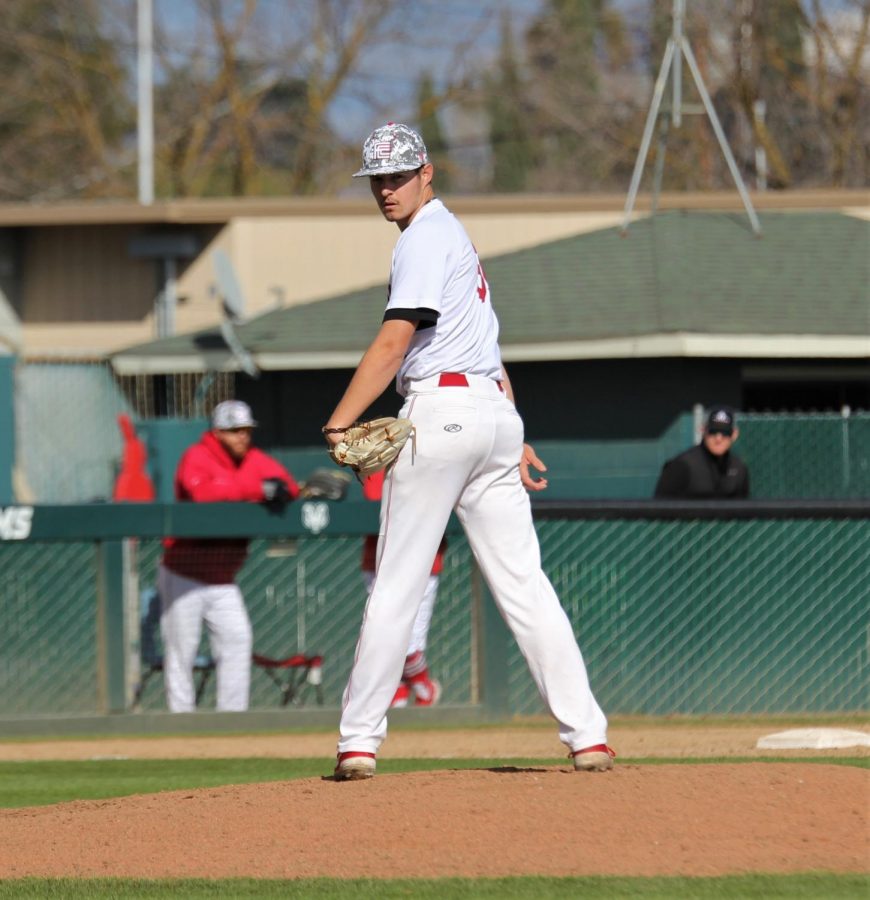 Rams+pitcher+Jack+Reitsma+stares+down+the+runner+on+first+in+the+Rams+9-8+comeback+win+against+Chabot+College+on+Feb.+9%2C+2019.+Photo+by+Ben+Hensley