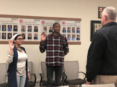 Dean of Students, Sean Henderson (right) swearing Senators Ruby Kaur (left) and Henry Evans (middle) into office in the FCC Senate Chambers on Feb. 12, 2019.