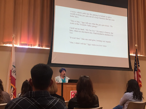 Laurel Doud reading excerpts from her unpublished novel “Inch Worm” at “The Language of the Brag: Celebrating Women Writers” event, honoring women during Women’s History Month March 21, 2019 in OAB 251.