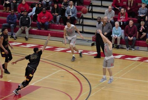 Rams' Freshman guard Eljay Gallegos puts up a three in the second round of the playoffs against Sacramento City College on March 2, 2019.