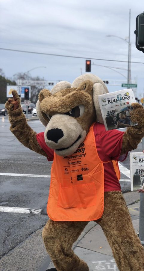 Rammie, FCC’s Mascot, standing out on the corner of Blackstone and McKinley asking for Kids Day donations of for the newspaper March 5, 2019. 