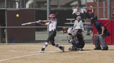 Rams sophomore outfielder Savannah Pena connects with a pitch that would end up deep over the left field fence for a home run during the Rams blowout win over Taft College on March 19, 2019.