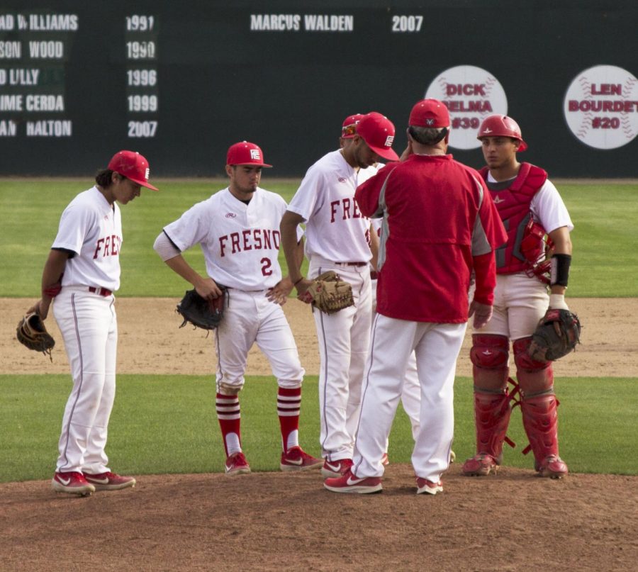 Rams pitching coach Eric Solberg meets with Giovanni Saavedra and the rest of the infield on the mound during the Rams 9-3 loss to COS on Tuesday, March 26 2019 at John Euless Park.