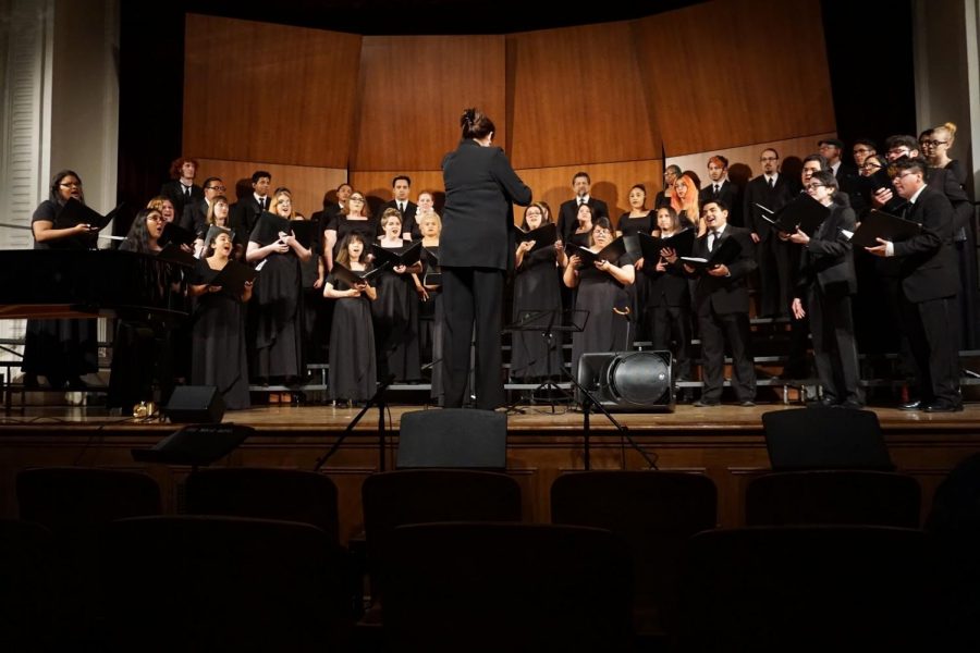 Julie R. Dana counsducts the FCC choir students on April 6 at the old administration building auditorium. 