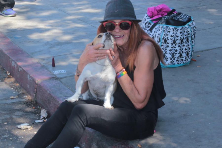 This is my little bruiser boy. Hes good protection. He dont like aggressiveness. Hes a good alarm, he does not hold back barking, and he barks at people who are no good. He has sense and Im grateful to him. Hes my best friend. Marianne Combs with Shiloh, April 24, 2019 outside of Mike McGarvin Jr. Village of Hope. 