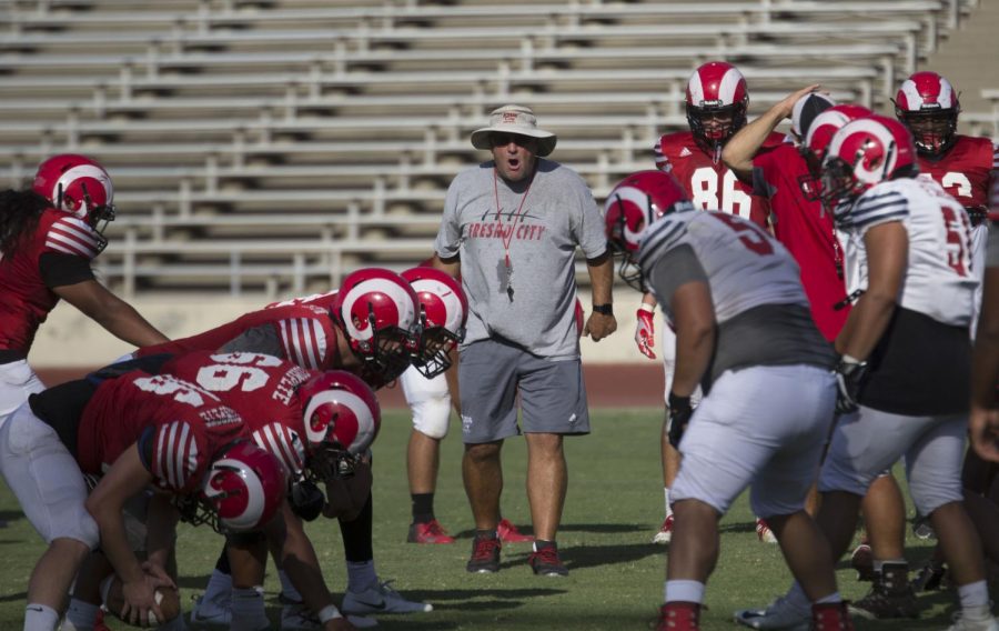 Head coach Tony Caviglia rallies the team during their practice on Tuesday, Aug. 27 2019. The Rams first home game is against Siskiyous on Saturday, Sept. 14, 2019.