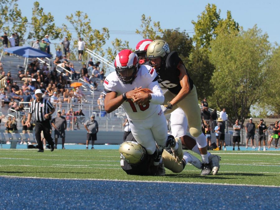Sophomore quarterback Jonah Johnson dives into the end zone during the Rams thrilling 13-10 win over the Butte College Roadrunners on Sept. 21, 2019.