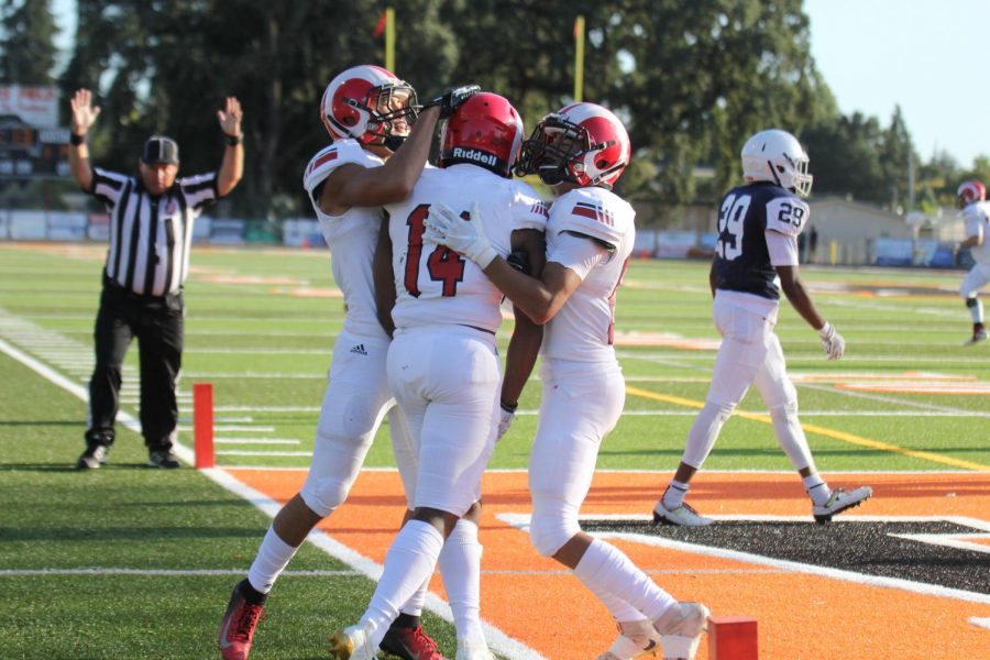 Rams sophomore wide receiver Chris Brown celebrates with teammates following a 14-yard touchdown completion from sophomore Quarterback Jonah Johnson on Sept. 7, 2019. The Rams defeated Santa Rosa Junior College 35-17 in their season opener.