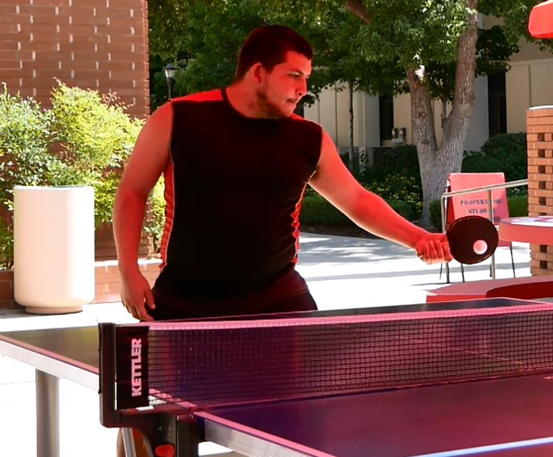 Jose Orozco returns a serve from Wilmer Vang during the finals round of the monthly ping pong tournament hosted by the Students Activities Center on Sept. 24, 2019.