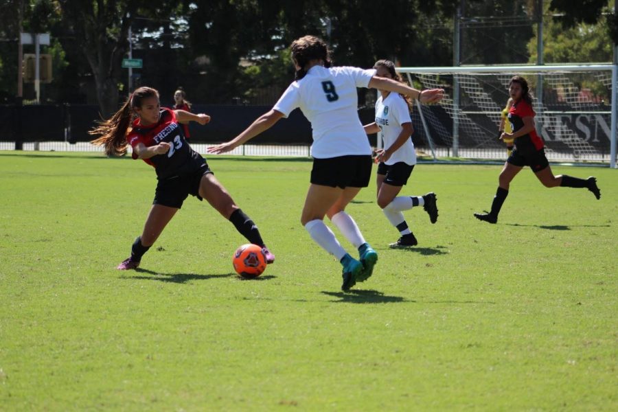 Rams freshman forward Megan Galvan slips past midfielder Melanie Ara in a 1-1 tie against Lake Tahoe on Sept. 20, 2019.