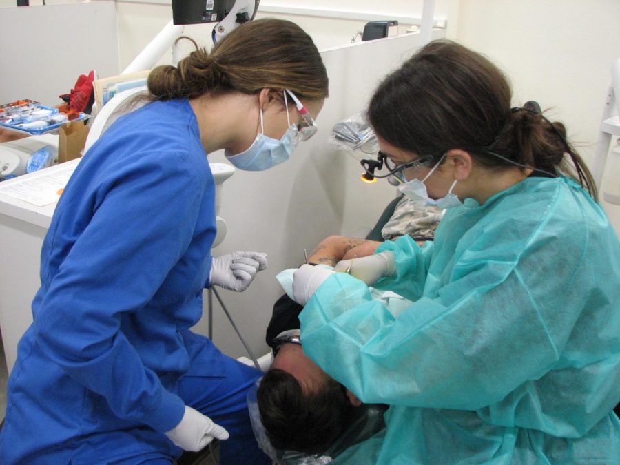 Second year students Mikaela Ehrastrom and Sarah Bartron perform a routine dental cleaning, at the FCC dental cleaning clinic,  Friday, Sept. 6, 2019. 