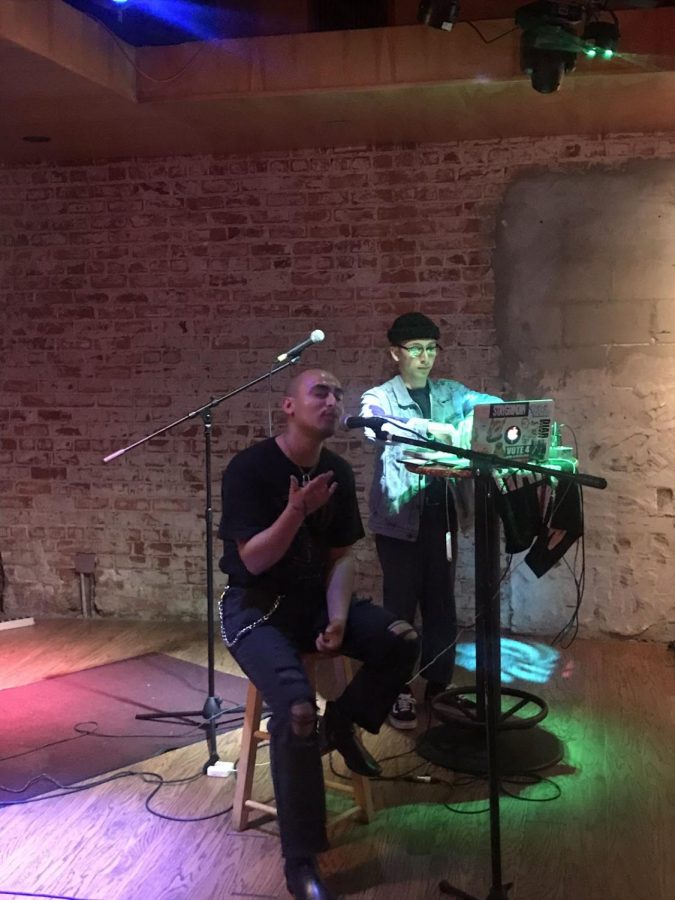 Performer Maximus Mendoza (left) and DJ Nate Ruiz (right) flow together at Strummers Monday Mixer on Oct. 14, 2019.