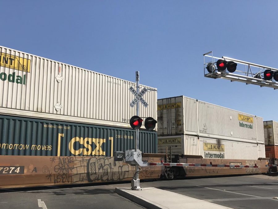 A BNSF train sits idle on the crossing at McKinley Avenue following a fatal collision with a pedestrian on Friday, Oct. 2019.