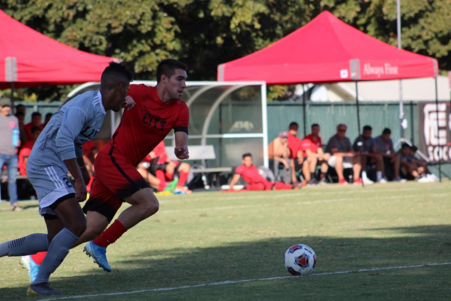 Rams sophomore forward Mason Gonzalez outruns LA an Mission College defender during the Rams 5-0 win on Tuesday, Oct. 8,.