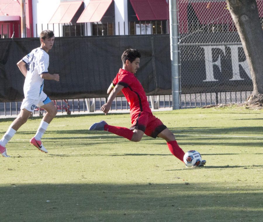 Sophomore midfielder Eduardo Segura passes to an inside teammate in the Rams match on Tuesday, Oct. 1.