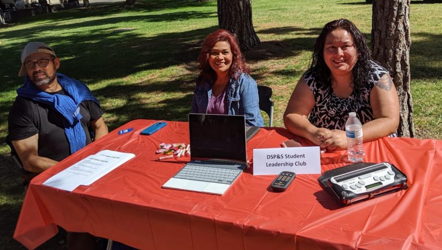 The new DSP&S club advertised the gear available to disabled students including a Google pixel for class. Pictured from left to right: club member Luis Santa, club member Matilda Woodard, and club president Veronica Hernandez.